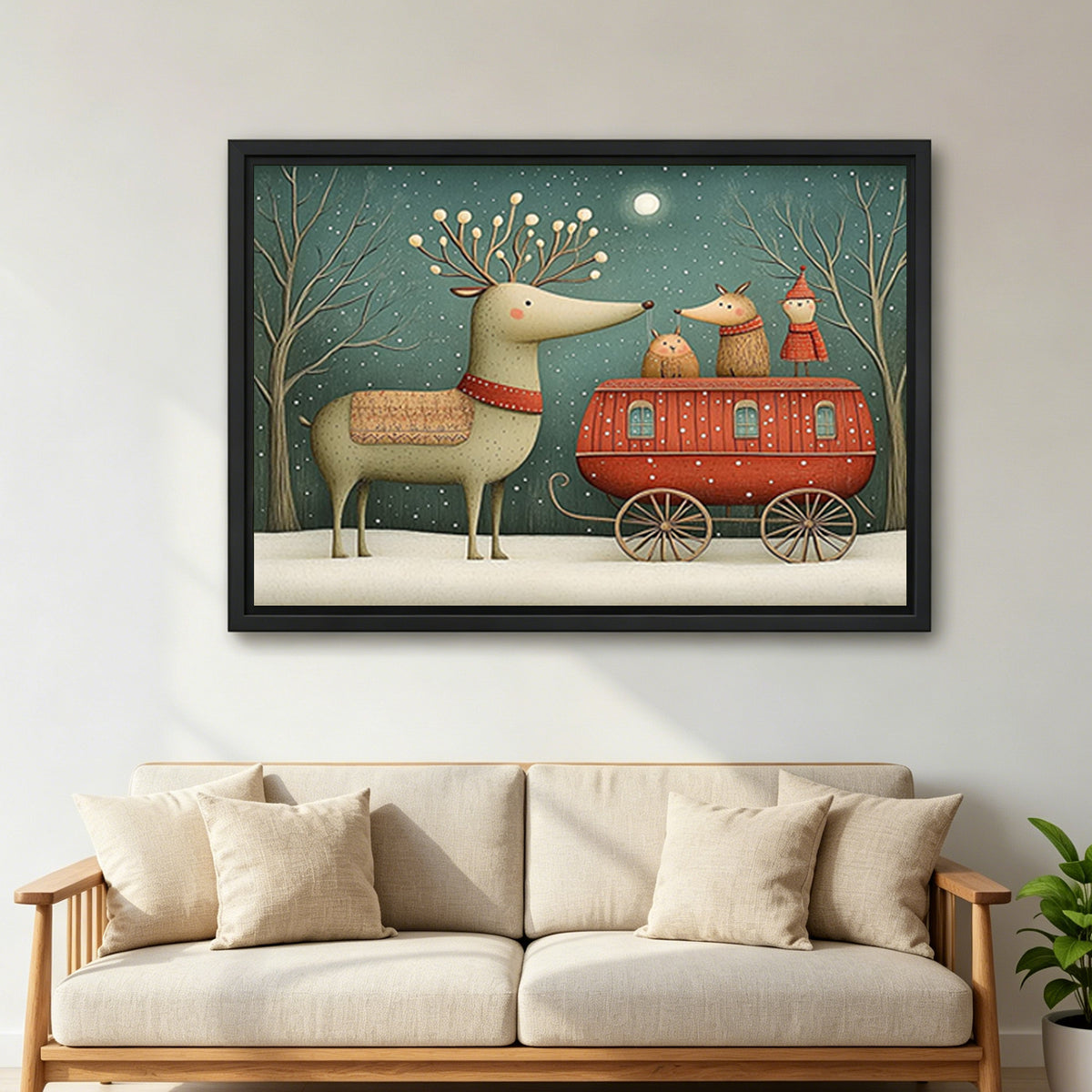 Large framed reindeer caravan canvas wall art above a cream sofa with cushions in a living room