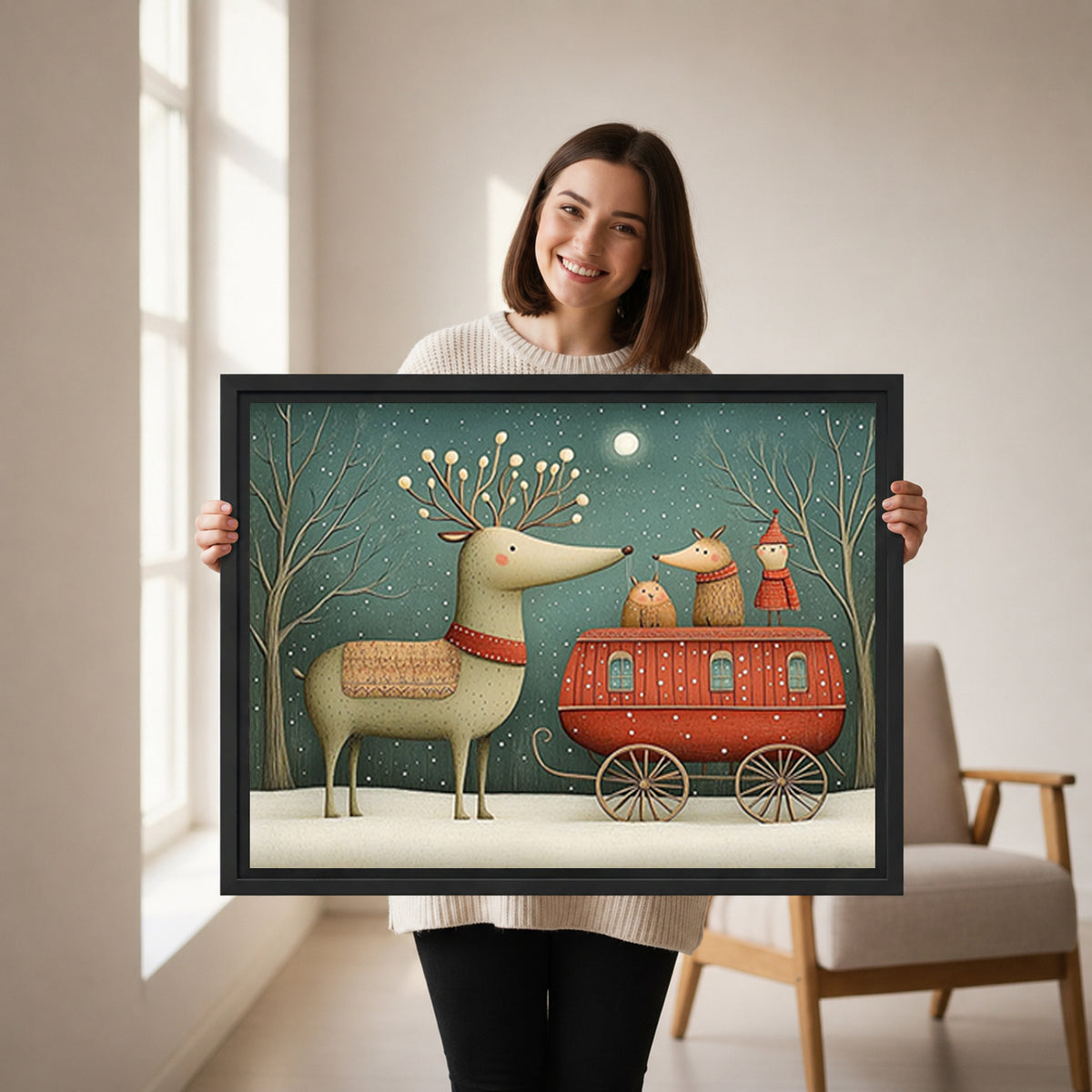 Woman holding framed reindeer caravan canvas wall art featuring a red wagon beneath a snowy teal sky