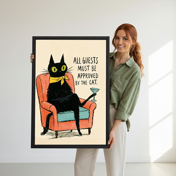 Retro black cat canvas wall art in a black frame above a cream sofa in a bright living room.