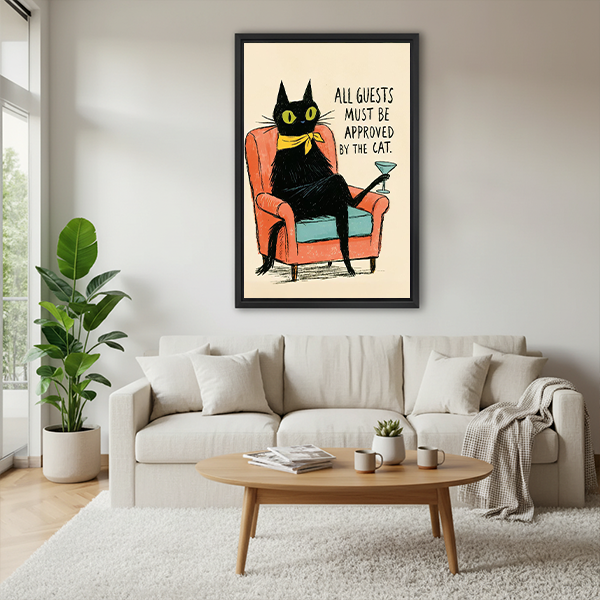 Framed retro black cat canvas wall art with a coral armchair beside a rattan bed and terracotta bedding.