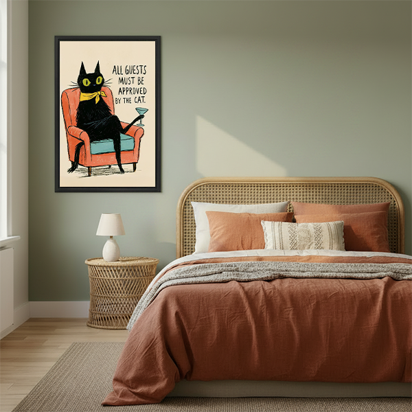 Woman holding framed retro black cat canvas wall art showing a lounging cat with a cocktail and humorous quote.