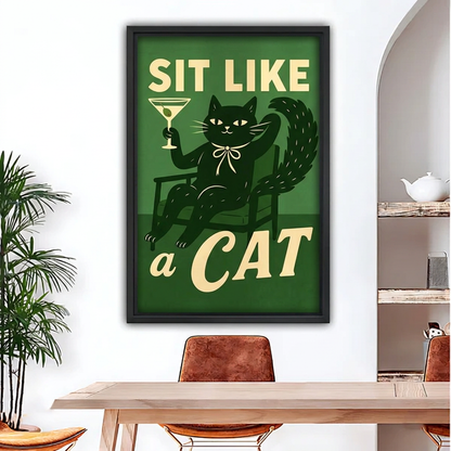 Black-framed retro black cat cocktail canvas wall art displayed above a wooden dining table beside arched shelves.
