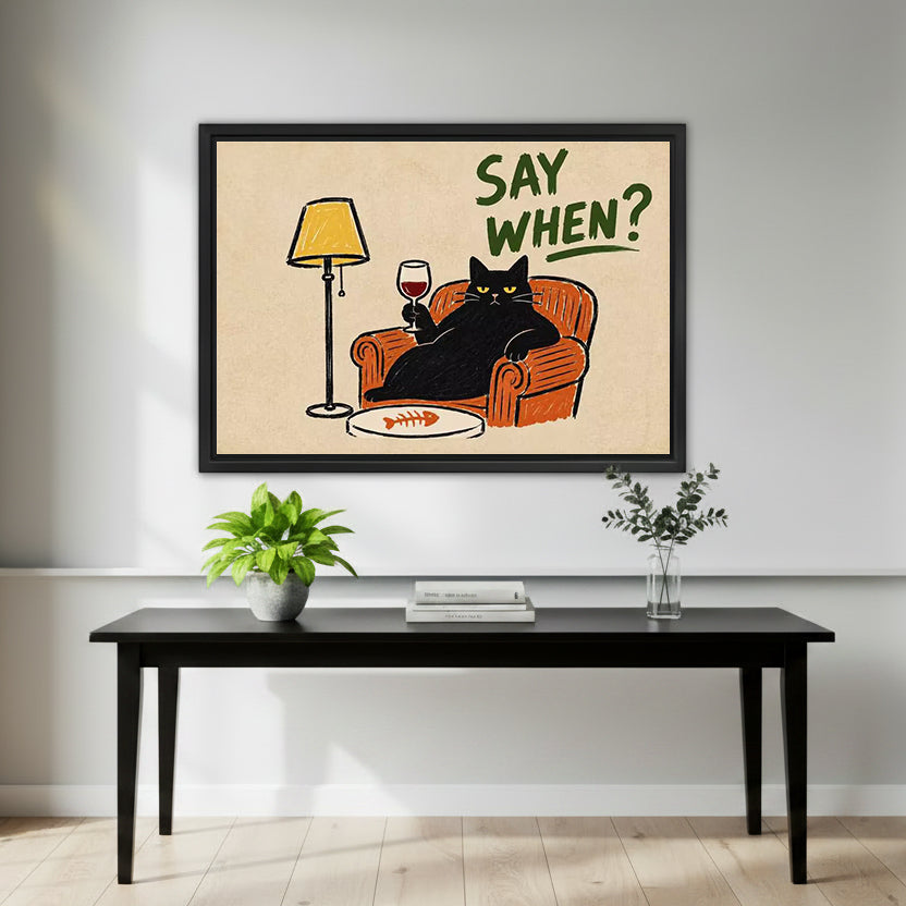 Retro black cat wine canvas wall art in a black frame above a black entryway table with green plants.