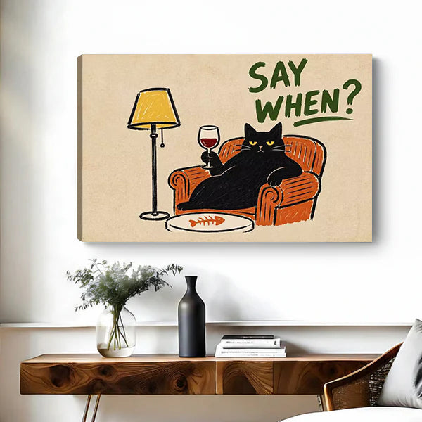 Frameless gallery-wrap retro black cat wine canvas wall art with a cat and wine glass over a wooden console.