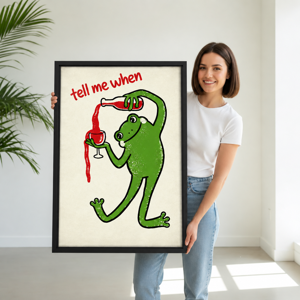 Smiling woman holding framed retro wine frog canvas wall art with the tell me when quote
