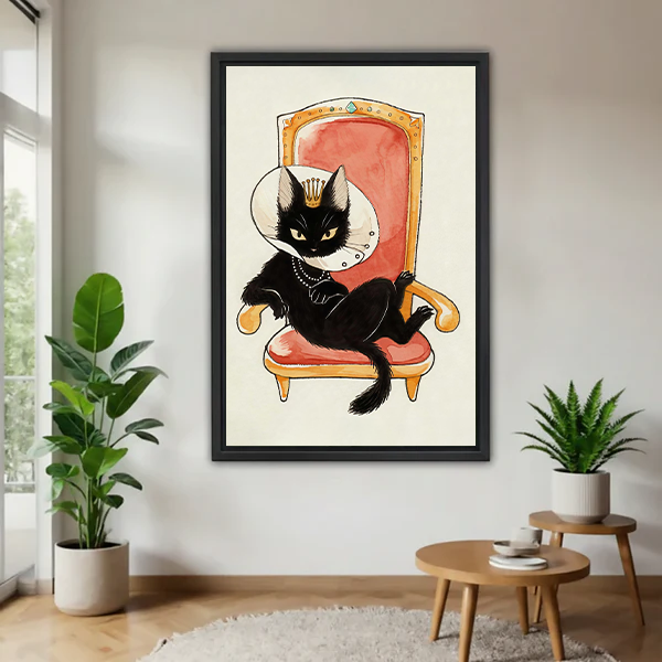Framed royal black cat canvas wall art with a crown and coral throne displayed above a cream living room sofa.