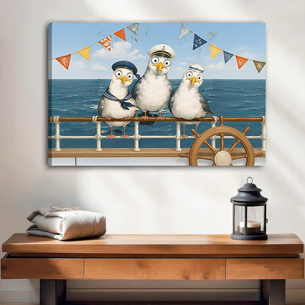 Whimsical sailor seagulls canvas wall art with ocean blues and colorful flags, framed above a cream sofa.