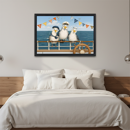 Woman holding framed sailor seagulls canvas wall art with three hat-wearing birds, colorful pennants, and blue ocean waves.