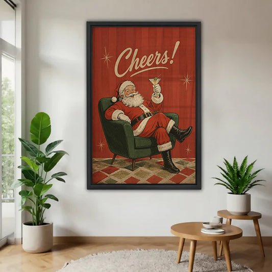 Black-framed Santa cocktail canvas wall art on a white wall beside plants