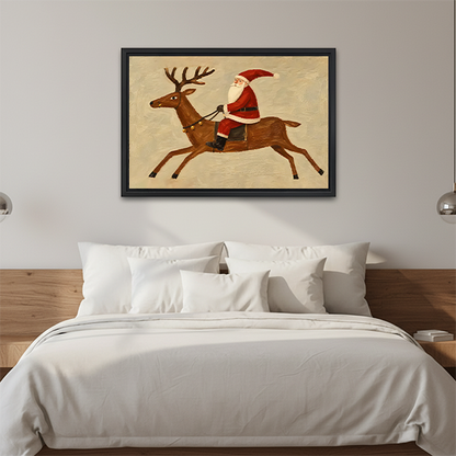 Santa riding reindeer canvas wall art in a black frame above white bedding and a natural wooden headboard.