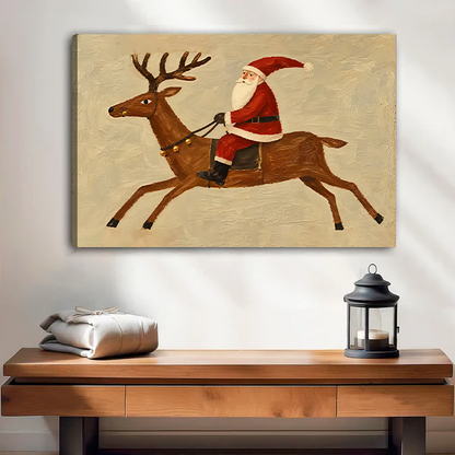Black-framed Santa riding reindeer canvas wall art above a wooden console with folded blankets and a black lantern.