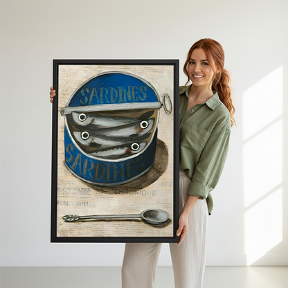 Sardine tin canvas wall art without an outer frame, featuring silver fish and a spoon above wooden tables.