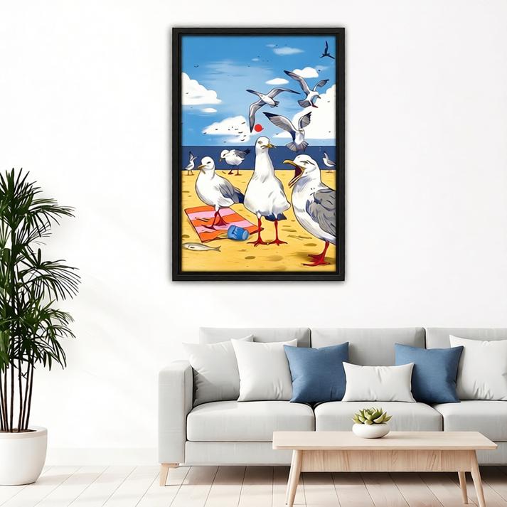 Framed seagull beach party canvas wall art above a gray sofa with blue cushions