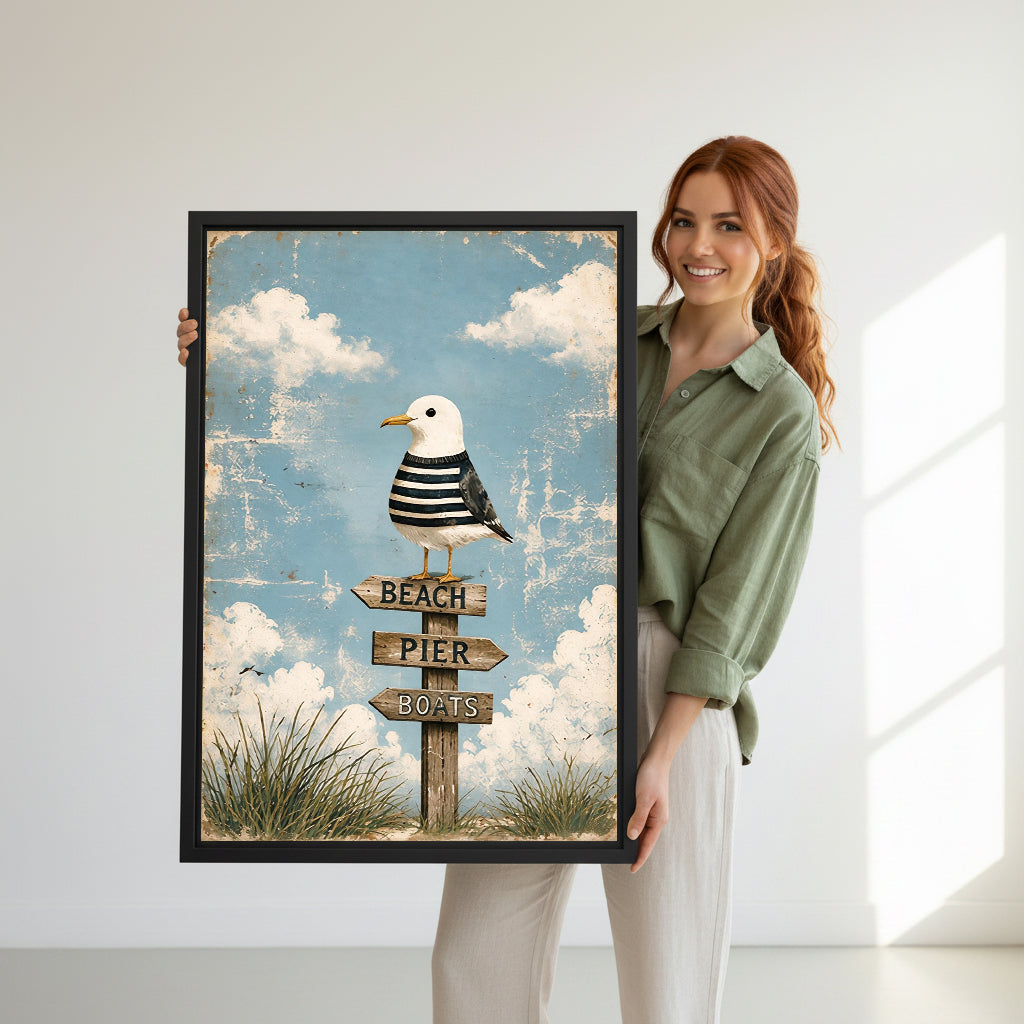 Model holding coastal seagull signpost canvas wall art for size reference