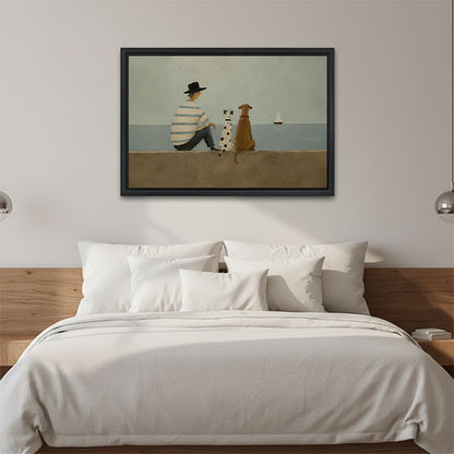 Black-framed seaside dogs canvas wall art featuring muted coastal colors above a wooden console beside a lantern.