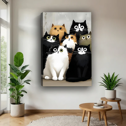 Whimsical seven cats canvas wall art in a black frame beside a rattan bed with terracotta bedding.