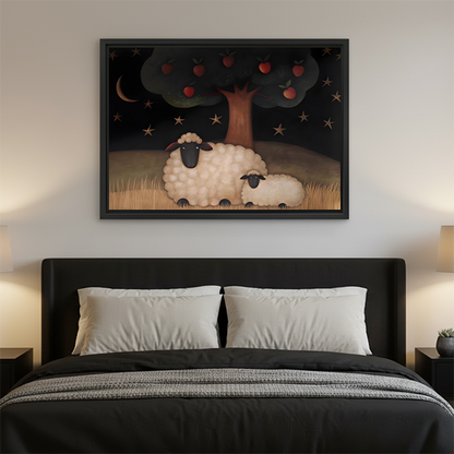 Sheep and apple tree canvas wall art in a black frame above a wooden console, depicting moonlit country companionship.