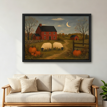 Woman holds framed sheep farm canvas wall art featuring a red farmhouse, pumpkins, and a crescent moon.
