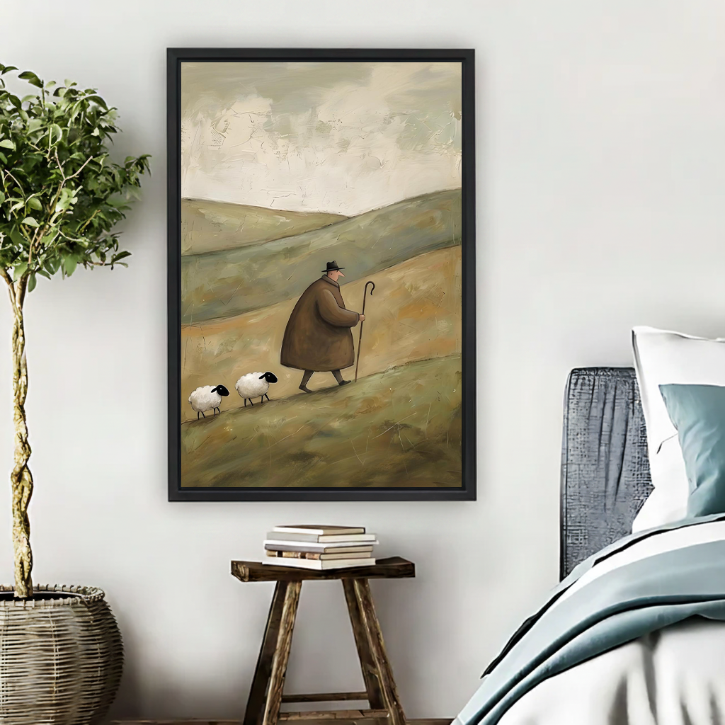 Rustic shepherd and sheep canvas wall art in a black frame beside a bed, tree, and wooden stool.