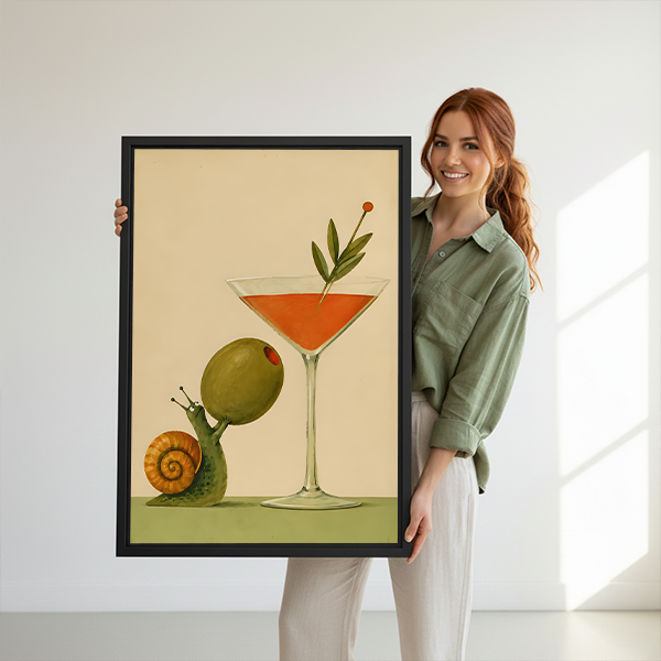 Black framed snail cocktail canvas wall art with cream and olive tones above a cream living room sofa.
