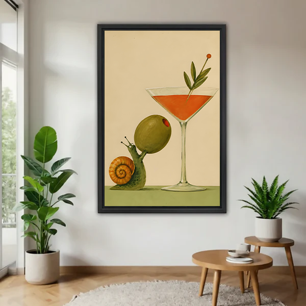 Framed snail cocktail canvas wall art featuring an oversized olive and orange drink, displayed between green houseplants.