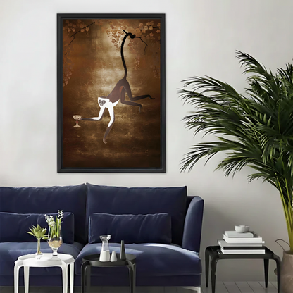 Framed spider monkey wall art print hanging above a navy blue sofa in a modern living room