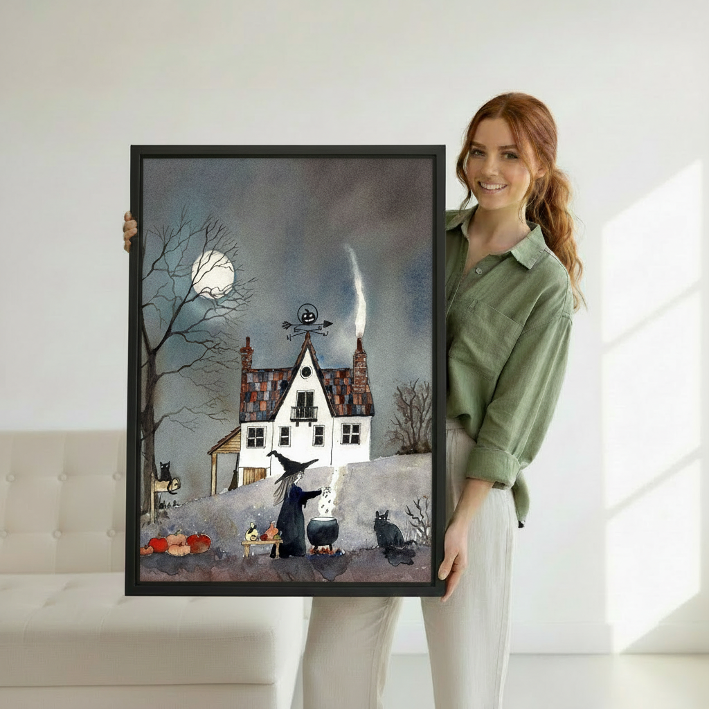 Framed spooky witch house canvas wall art held by a woman to show its scale.