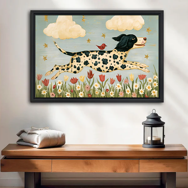 Black-framed spotted dog and bird canvas wall art with flowers and clouds displayed above a white bed.