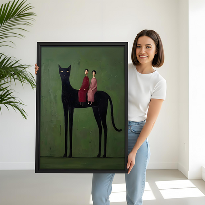 Woman holding a framed surreal black cat folk wall art print for size reference