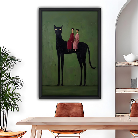 Surreal black cat folk wall art in black frame above a wooden dining table