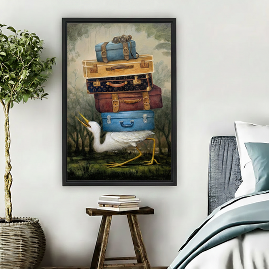 Surreal white egret carrying vintage luggage framed canvas bedroom wall art beside wooden stool