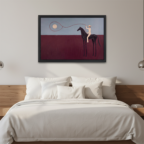 Surreal horse rider canvas wall art above a white bed, showing a wide-brimmed hat, dark horse, and burgundy field.