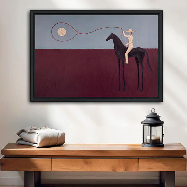 Surreal horse rider canvas wall art above a wooden console, showing a dark horse, pale rider, and looped line.