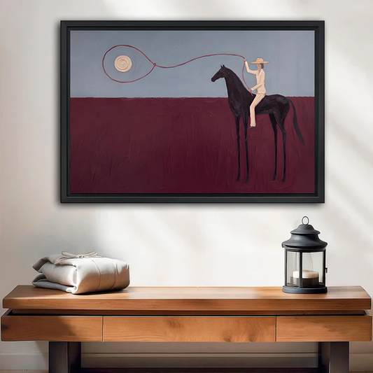 Surreal horse rider canvas wall art above a wooden console, showing a dark horse, pale rider, and looped line.