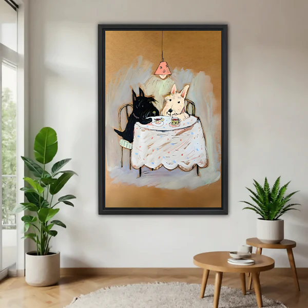 Black-framed terrier tea party canvas wall art above a cream sofa and wooden coffee table in a bright room.