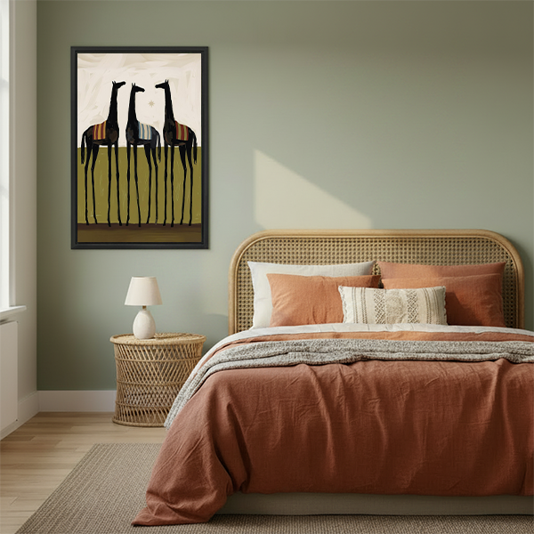 Modern folk art three black horses canvas wall art in a black frame above a cream living room sofa.