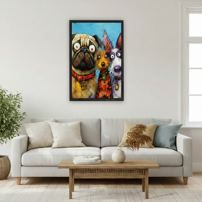 Black framed funny dog trio wall art hung above a light grey sofa in a bright Scandinavian living room, featuring a wide-eyed pug, fluffy terrier, and schnauzer in a colorful expressive painting style on a turquoise background
