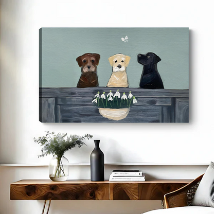 Chocolate yellow and black Labrador dogs with snowdrops canvas art print displayed on wall without frame