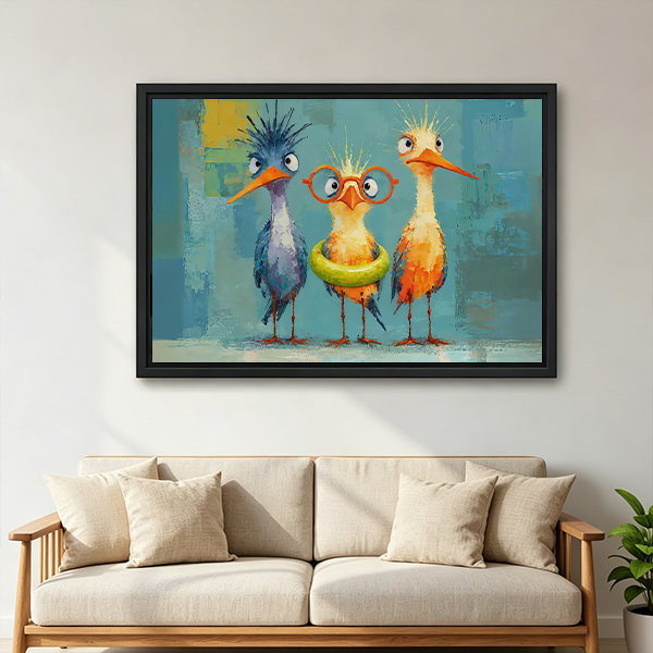Black-framed three quirky birds canvas wall art above a wooden console with folded blankets and a black lantern.