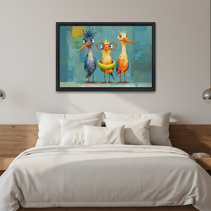 Framed three quirky birds canvas wall art with blue and orange birds above a bed with white bedding.