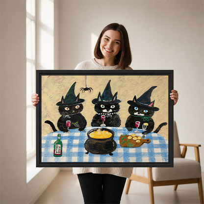 Whimsical three witch cats canvas wall art without an outer frame above a wooden console beside a black lantern.