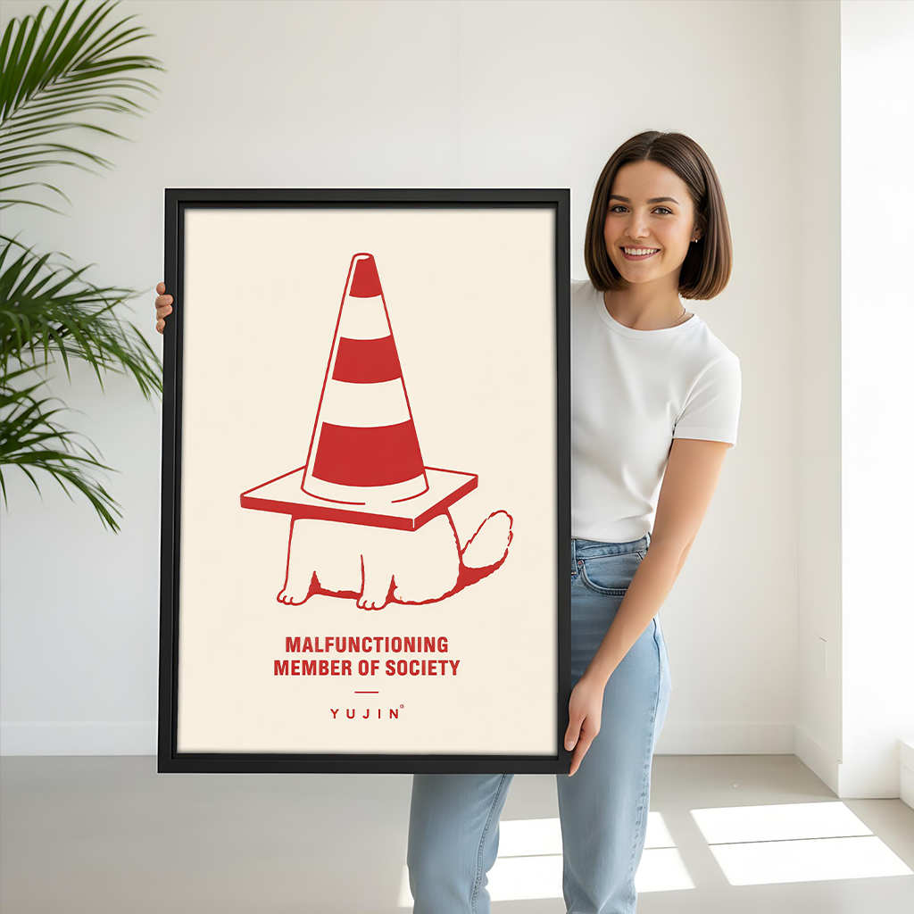 Woman holding black-framed traffic cone cat canvas wall art featuring a striped cone and Malfunctioning Member of Society quote.