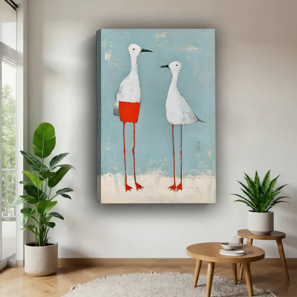 Woman holding framed two white birds canvas wall art against a soft blue backdrop.