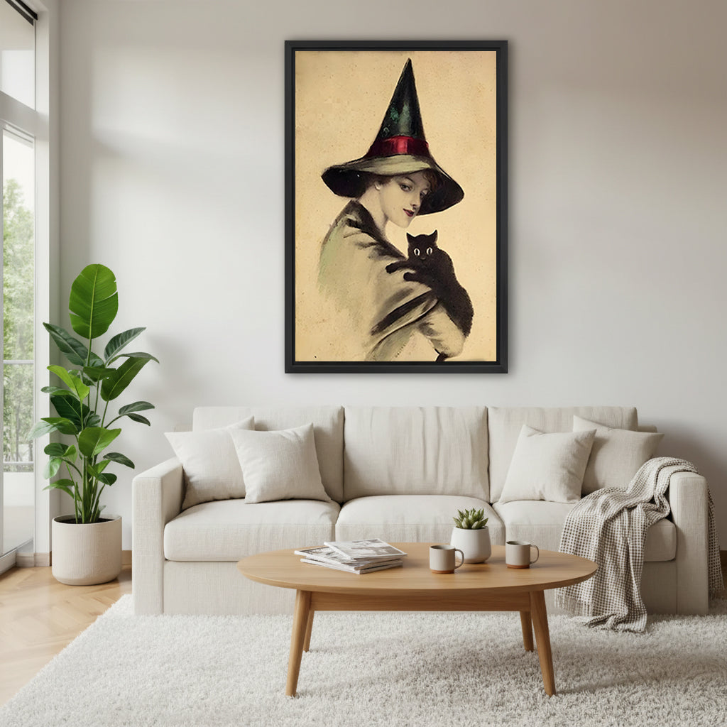 Victorian witch black cat vintage black framed canvas above cream sofa with oval wood coffee table and gray throw