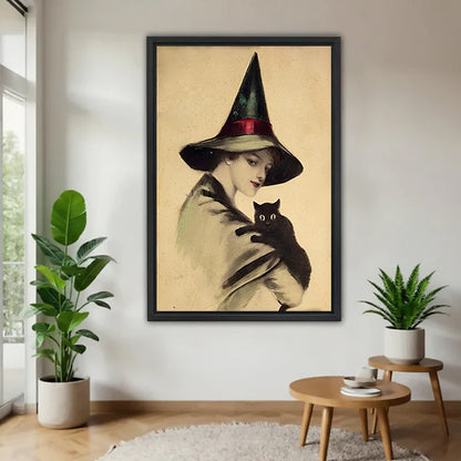 Victorian witch black cat vintage black framed canvas on white wall with two plants and round wood side table