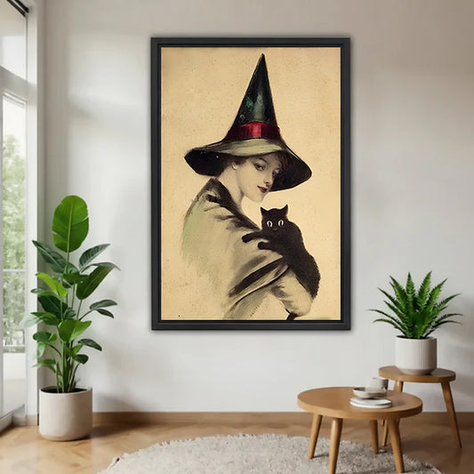 Victorian witch black cat vintage black framed canvas on white wall with two plants and round wood side table
