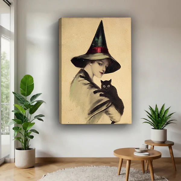 Victorian witch black cat vintage gallery wrap canvas on white wall with monstera plant and round wood side table