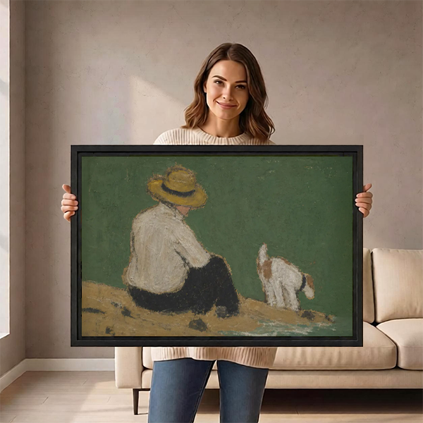 Woman holding a large framed vintage oil painting wall art print of a boy and dog by the water, showing print scale and black frame detail
