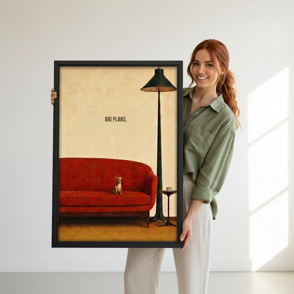 Woman holding black-framed vintage dog red sofa canvas wall art featuring a small dog beneath “Big Plans” lettering.