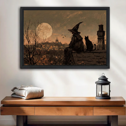 Vintage gothic witch and black cat framed canvas art above a wooden entryway console table with lantern accent decor